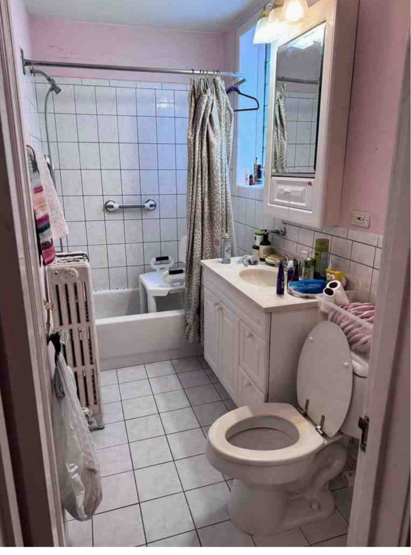 2130 West Farwell Avenue Chicago, IL 60645 - Photo 10 of 14 a bathroom with a sink toilet and shower