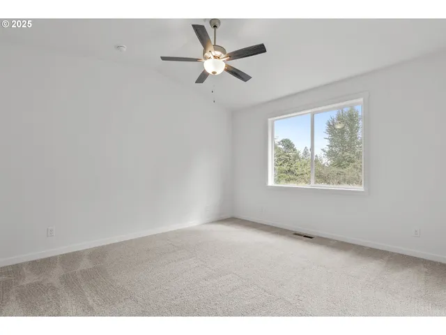 a view of a big room with carpet