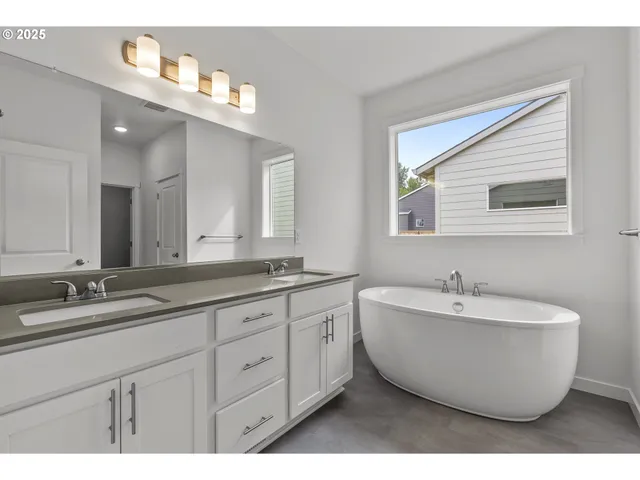 a bathroom with a sink and a window