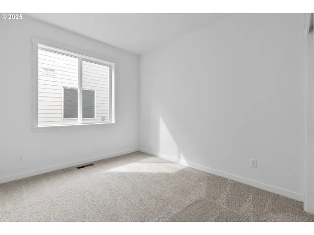 a bathroom with a granite countertop sink a toilet and a mirror