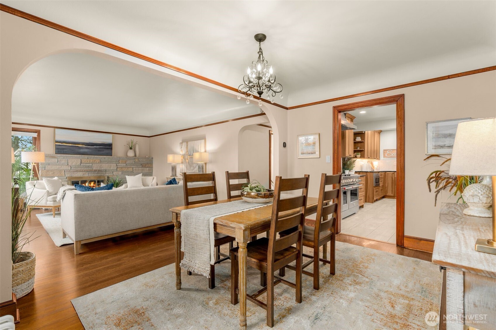 2351 47th Avenue Southwest Seattle, WA 98116 - Photo 12 of 40 a dining room with furniture a chandelier and wooden floor