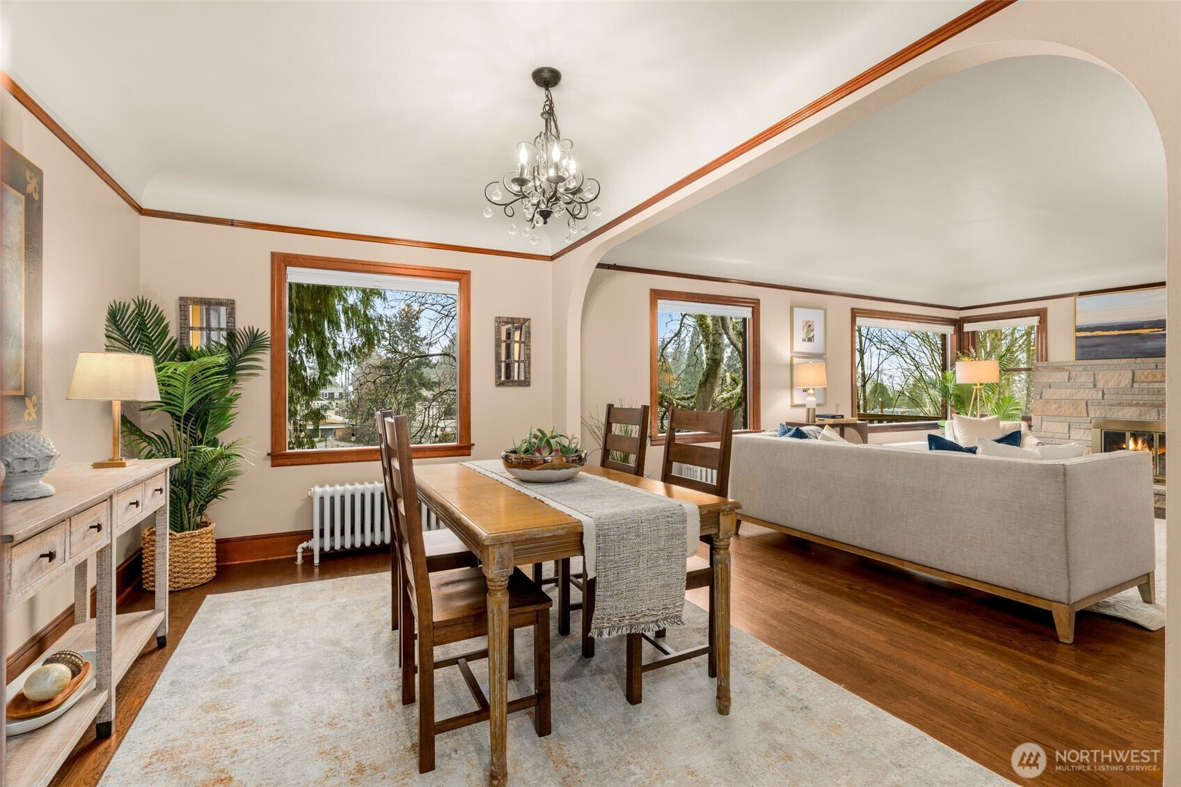 2351 47th Avenue Southwest Seattle, WA 98116 - Photo 13 of 40 a living room with furniture a chandelier and a dining table