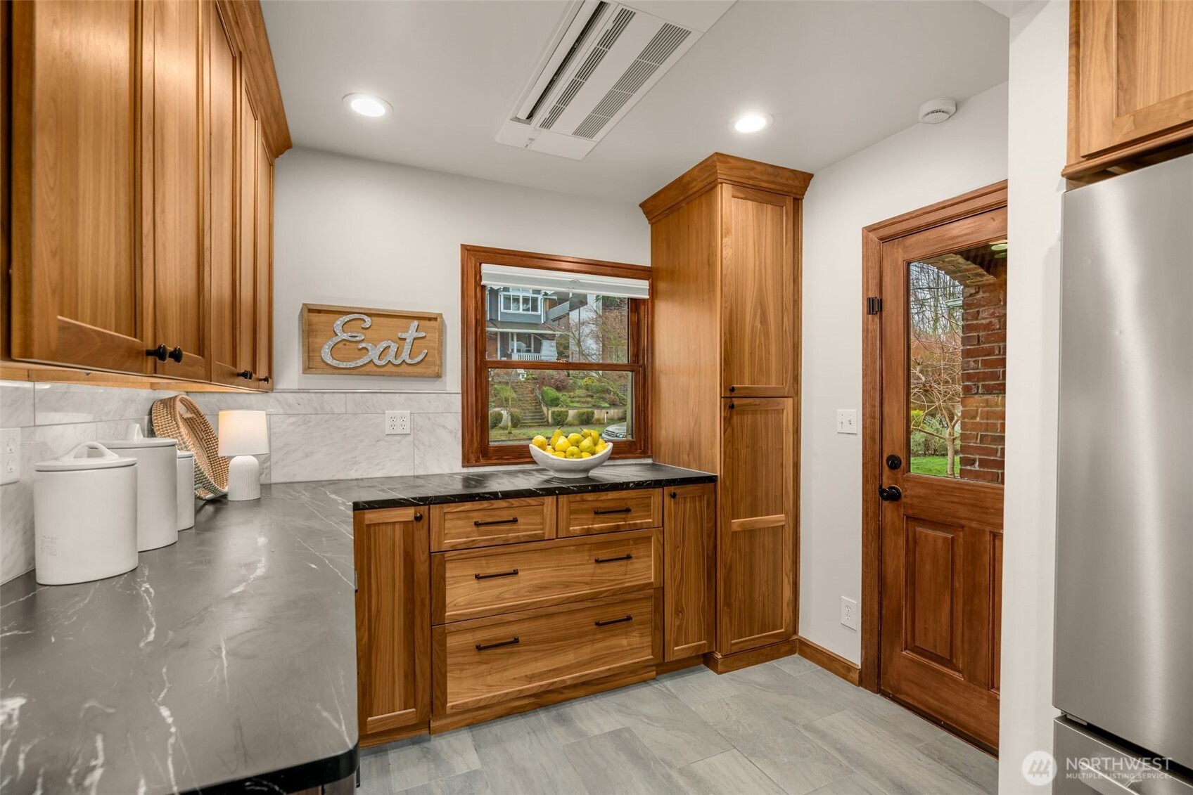 2351 47th Avenue Southwest Seattle, WA 98116 - Photo 17 of 40 a bathroom with a sink a mirror and a shower