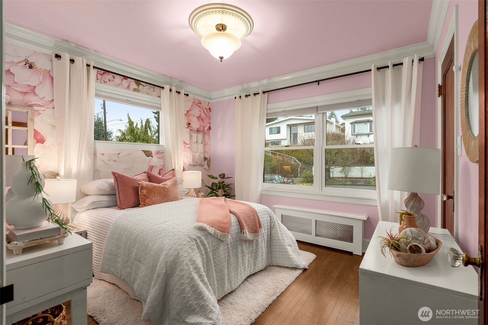 2351 47th Avenue Southwest Seattle, WA 98116 - Photo 18 of 40 a bed room with a bed and a window