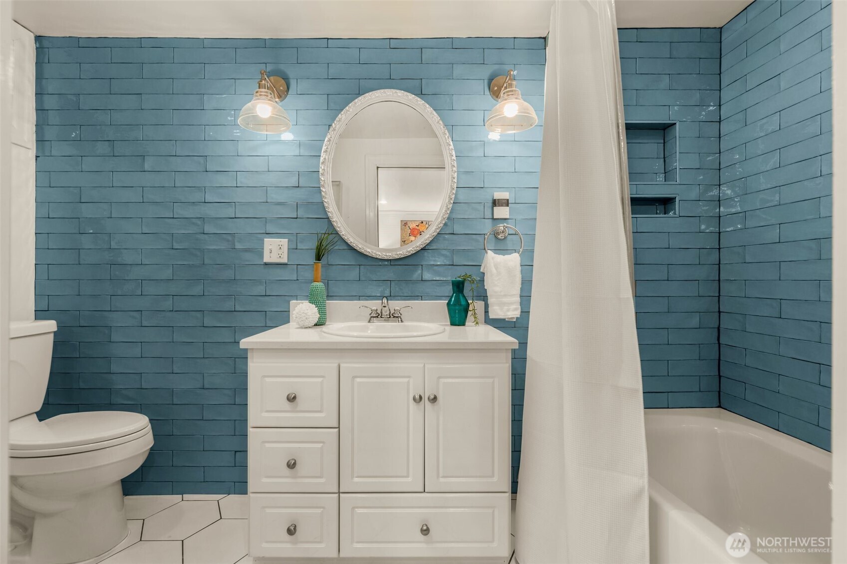 2351 47th Avenue Southwest Seattle, WA 98116 - Photo 28 of 40 a bathroom with a sink a toilet and a bathtub