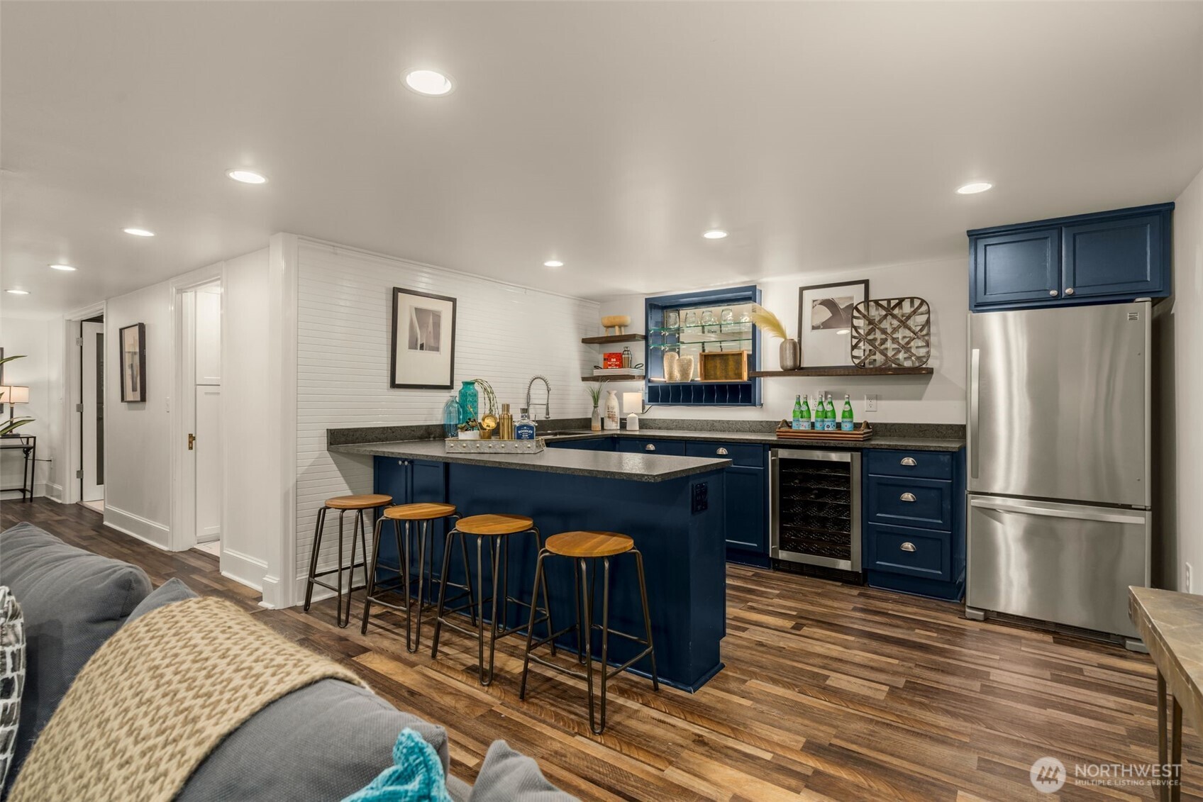 2351 47th Avenue Southwest Seattle, WA 98116 - Photo 31 of 40 a kitchen with stainless steel appliances granite countertop a refrigerator and a stove top oven