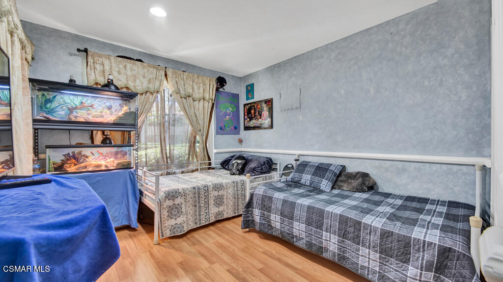 1712 Sinaloa Road, Unit 106 Simi Valley, CA 93065 - Photo 14 of 30 a bedroom with two beds and painted walls