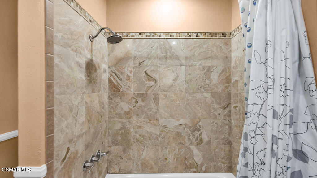 1712 Sinaloa Road, Unit 106 Simi Valley, CA 93065 - Photo 16 of 30 a bathroom with a shower
