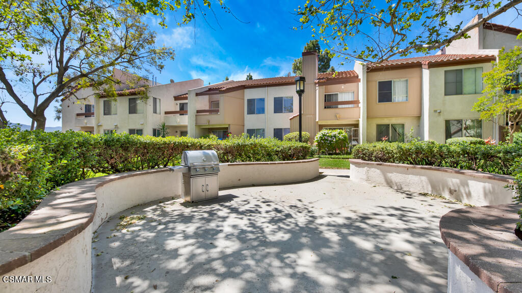 1712 Sinaloa Road, Unit 106 Simi Valley, CA 93065 - Photo 19 of 30 a house with lots of trees in the background