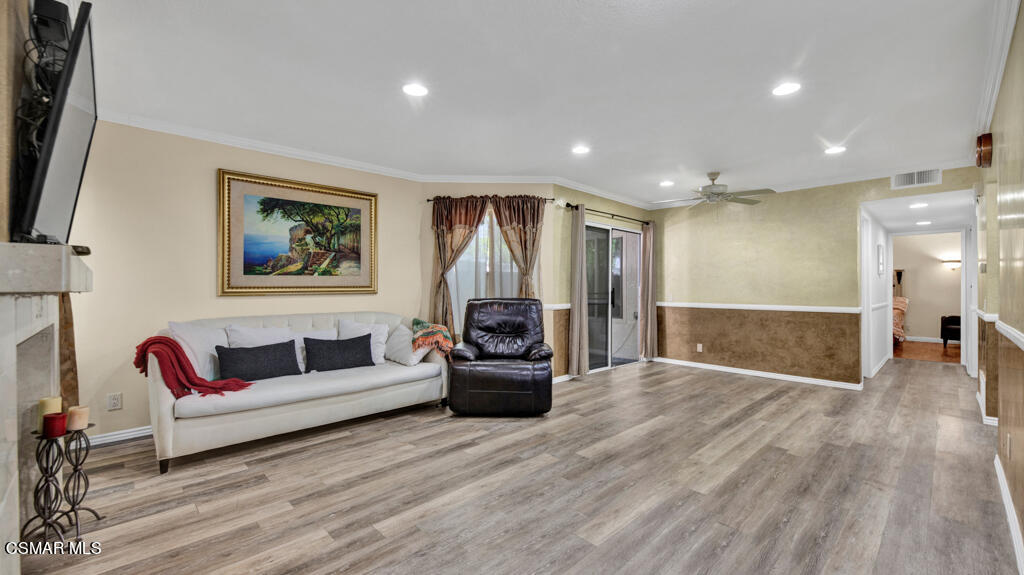 1712 Sinaloa Road, Unit 106 Simi Valley, CA 93065 - Photo 3 of 30 a living room with furniture and a wooden floor
