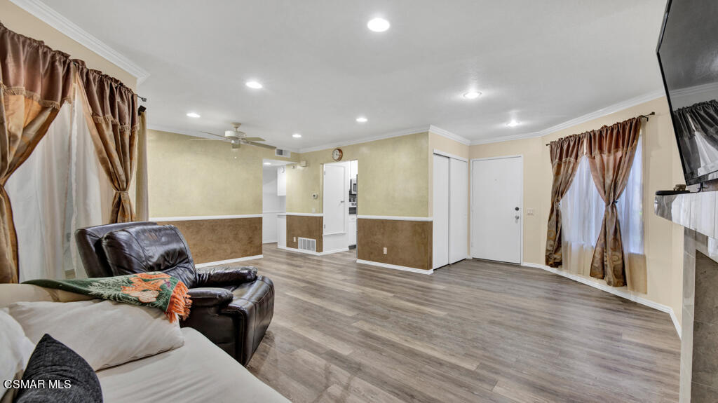 1712 Sinaloa Road, Unit 106 Simi Valley, CA 93065 - Photo 4 of 30 a living room with furniture and a flat screen tv
