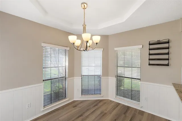 a view of a livingroom with wooden floor