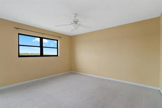 a view of an empty room with a bathroom