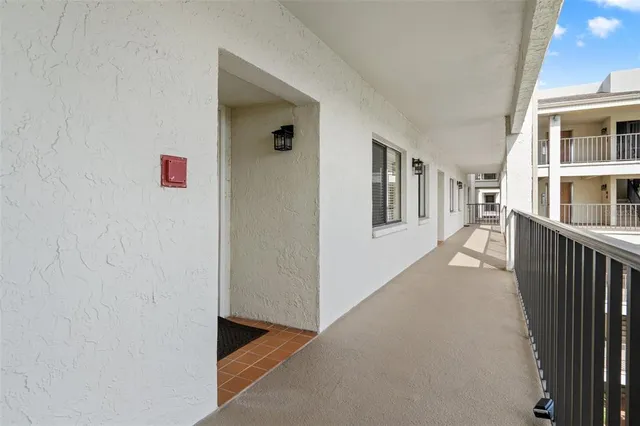 a view of closet with wooden floor