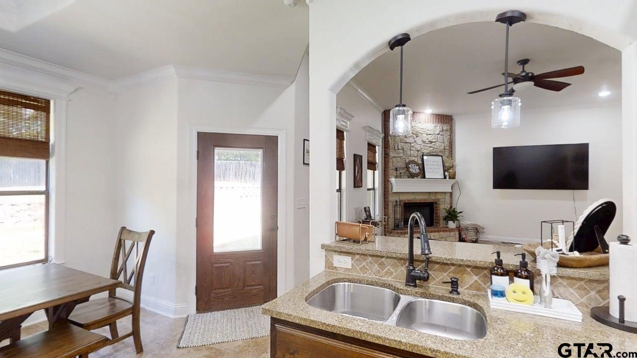 809 Crepe Myrtle Lane Longview, TX 75604 - Photo 12 of 39 a kitchen view with a sink table and chairs