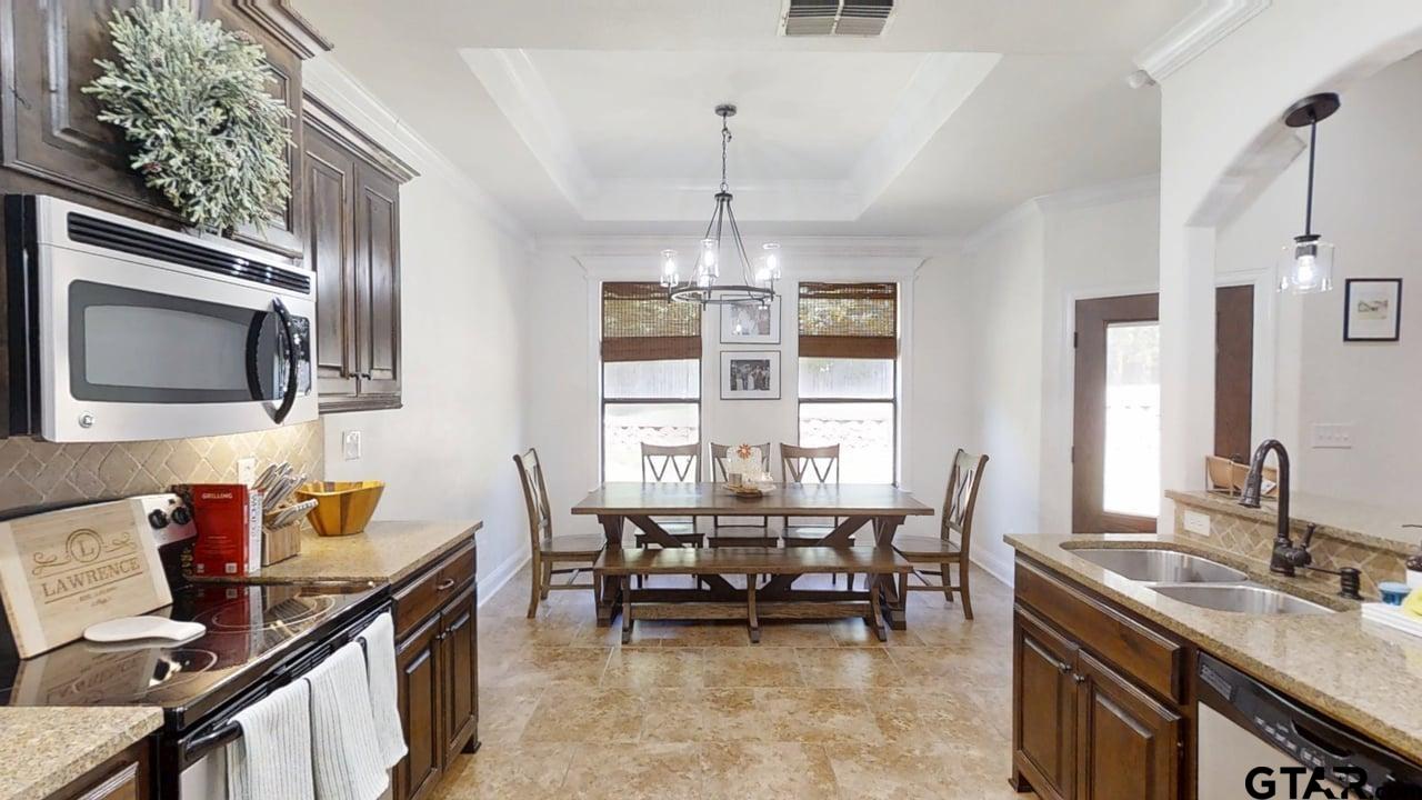 809 Crepe Myrtle Lane Longview, TX 75604 - Photo 14 of 39 a dining room with furniture and window