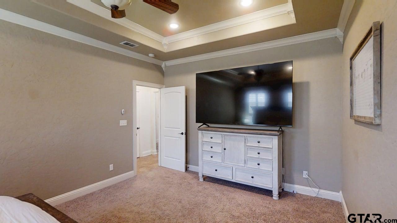 809 Crepe Myrtle Lane Longview, TX 75604 - Photo 18 of 39 a room with furniture and flat screen tv