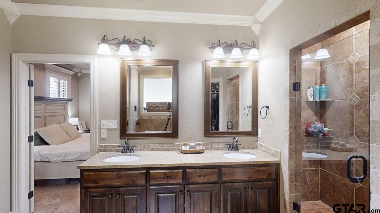 809 Crepe Myrtle Lane Longview, TX 75604 - Photo 21 of 39 a bathroom with a sink and a mirror