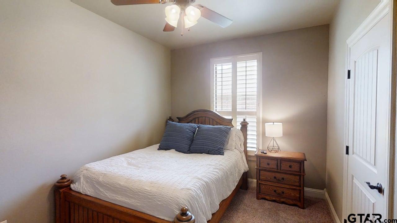 809 Crepe Myrtle Lane Longview, TX 75604 - Photo 26 of 39 a bedroom with a bed and a window