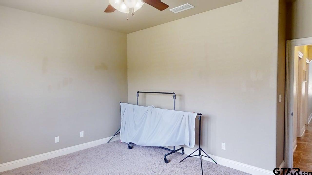 809 Crepe Myrtle Lane Longview, TX 75604 - Photo 29 of 39 a room with a table and a chandelier