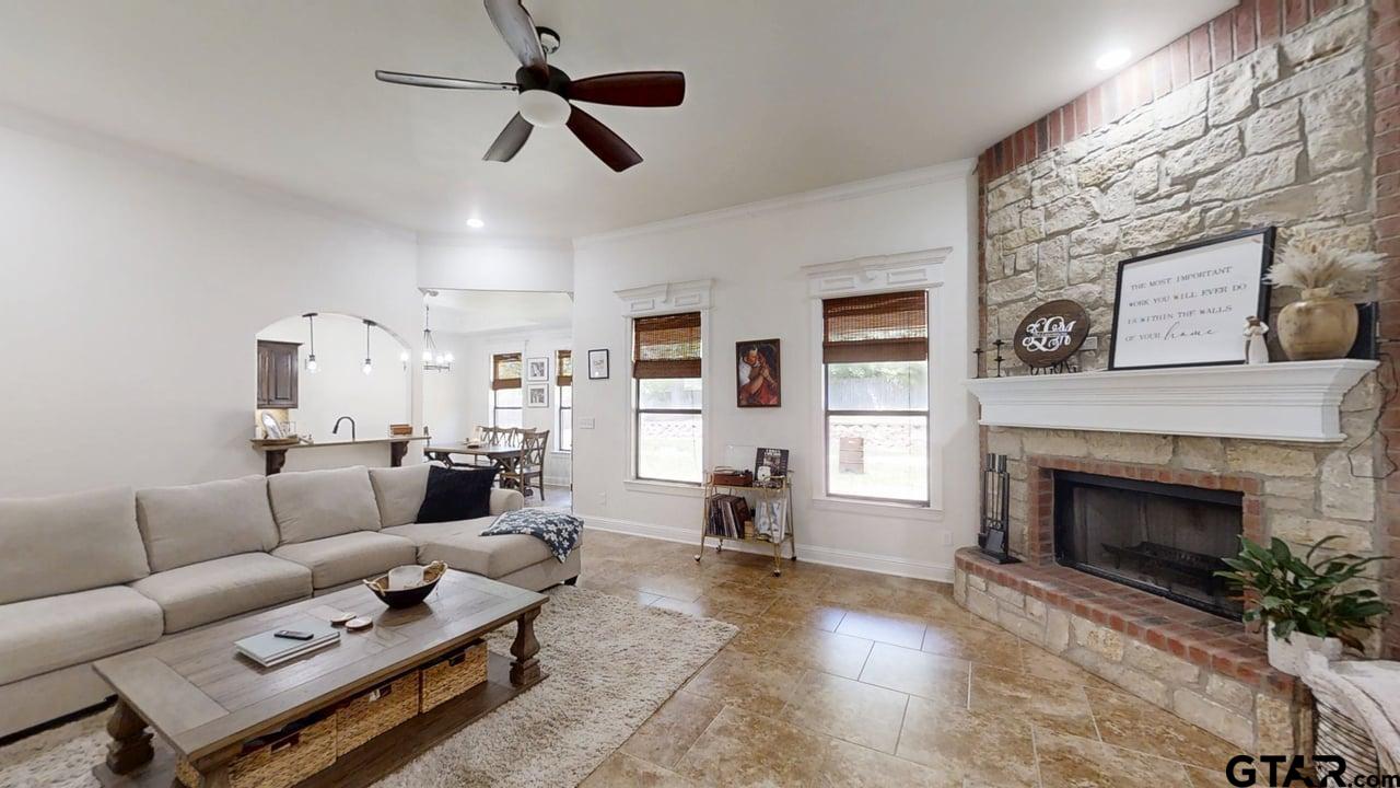 809 Crepe Myrtle Lane Longview, TX 75604 - Photo 3 of 39 a living room with furniture and a fireplace