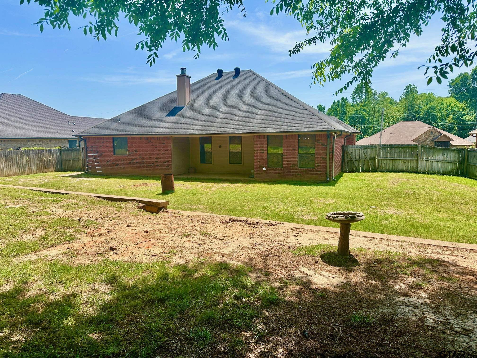 809 Crepe Myrtle Lane Longview, TX 75604 - Photo 33 of 39 a front view of a house with a yard