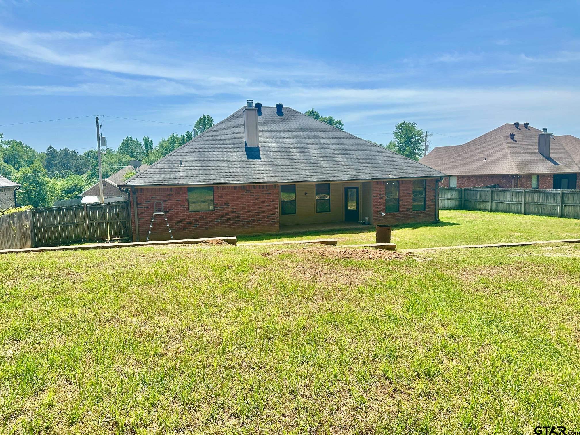 809 Crepe Myrtle Lane Longview, TX 75604 - Photo 34 of 39 a view of a house with a yard