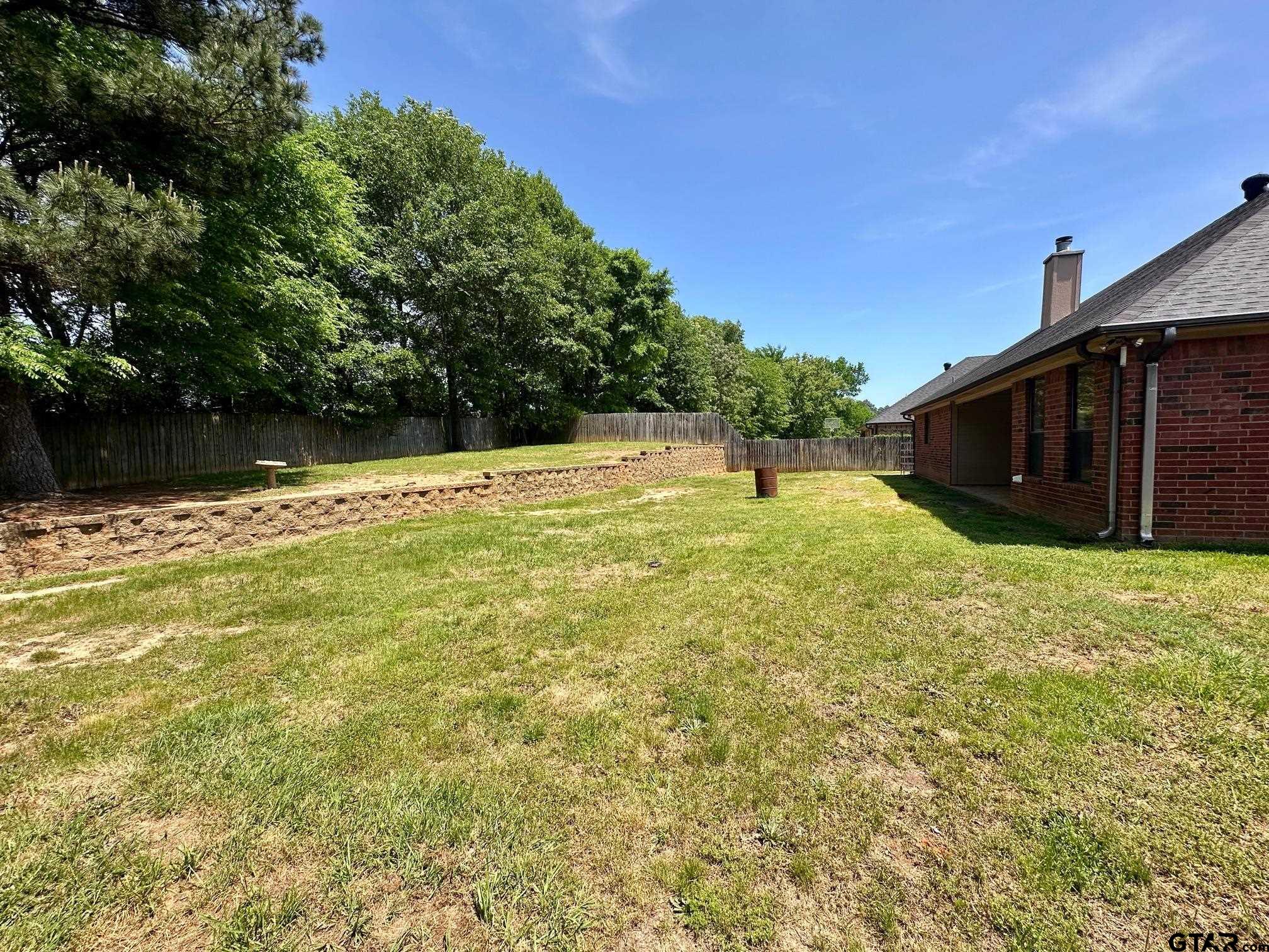 809 Crepe Myrtle Lane Longview, TX 75604 - Photo 36 of 39 a swimming pool with wooden fence