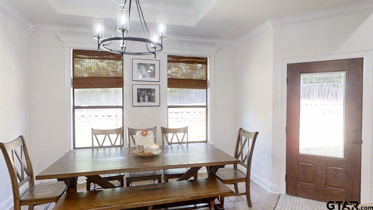 809 Crepe Myrtle Lane Longview, TX 75604 - Photo 10 of 39 a view of a dining room with furniture window and wooden floor