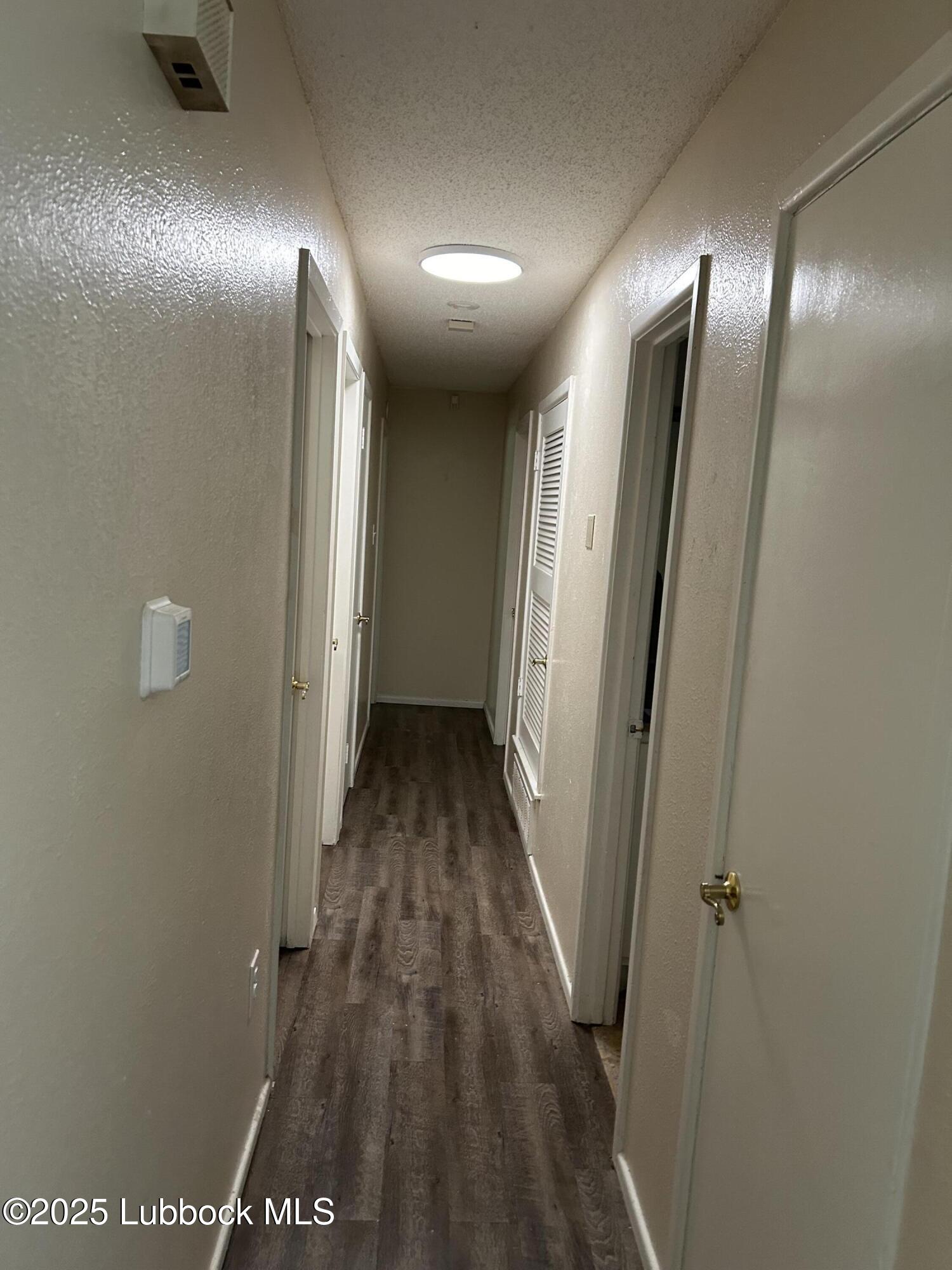 4809 8th Street Lubbock, TX 79416 - Photo 13 of 15 a view of a hallway