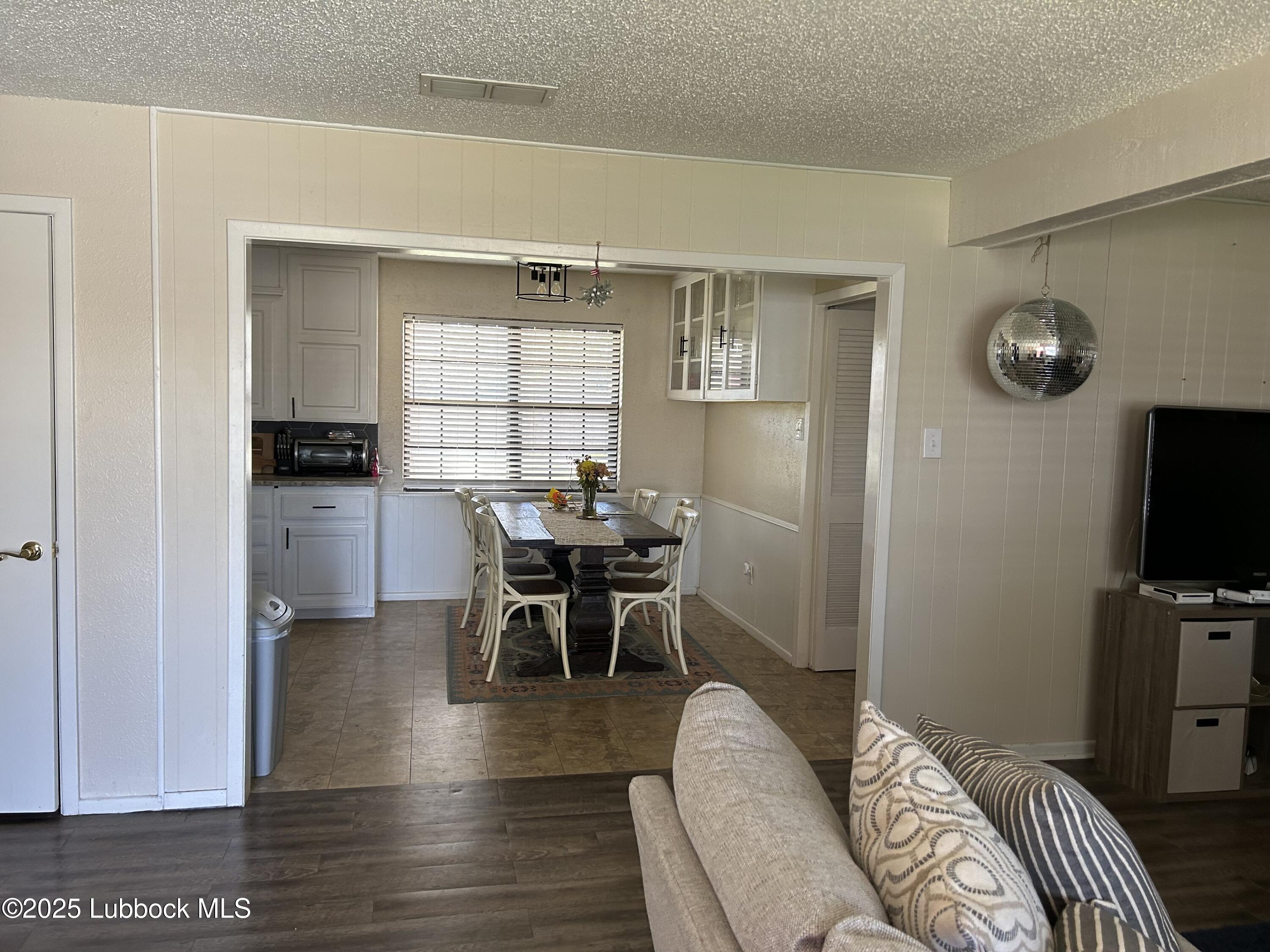 4809 8th Street Lubbock, TX 79416 - Photo 5 of 15 a view of a livingroom with furniture and window