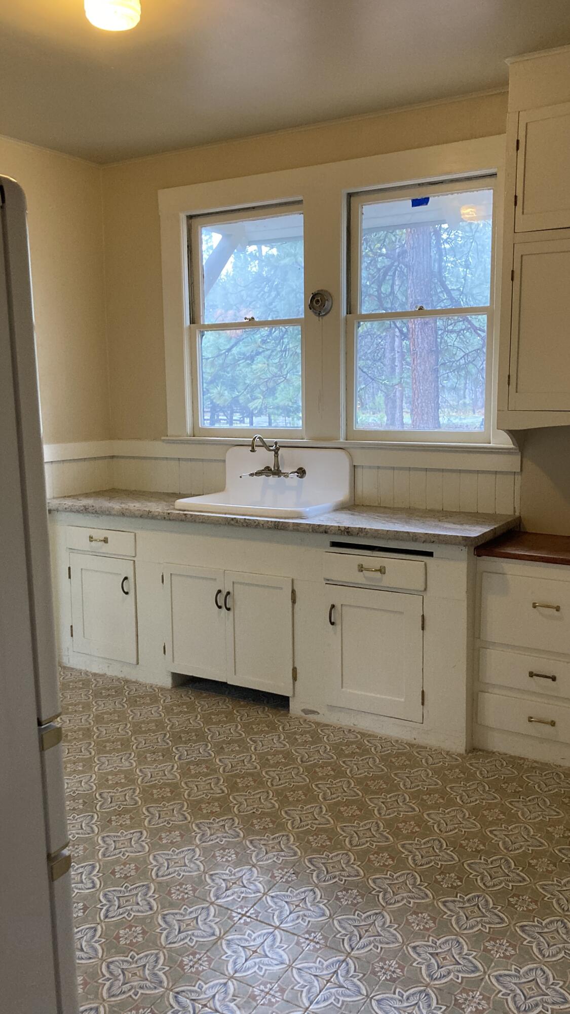 41008 Old School Road Fall River Mills, CA 96028 - Photo 33 of 53 a kitchen with granite countertop a sink window and cabinets