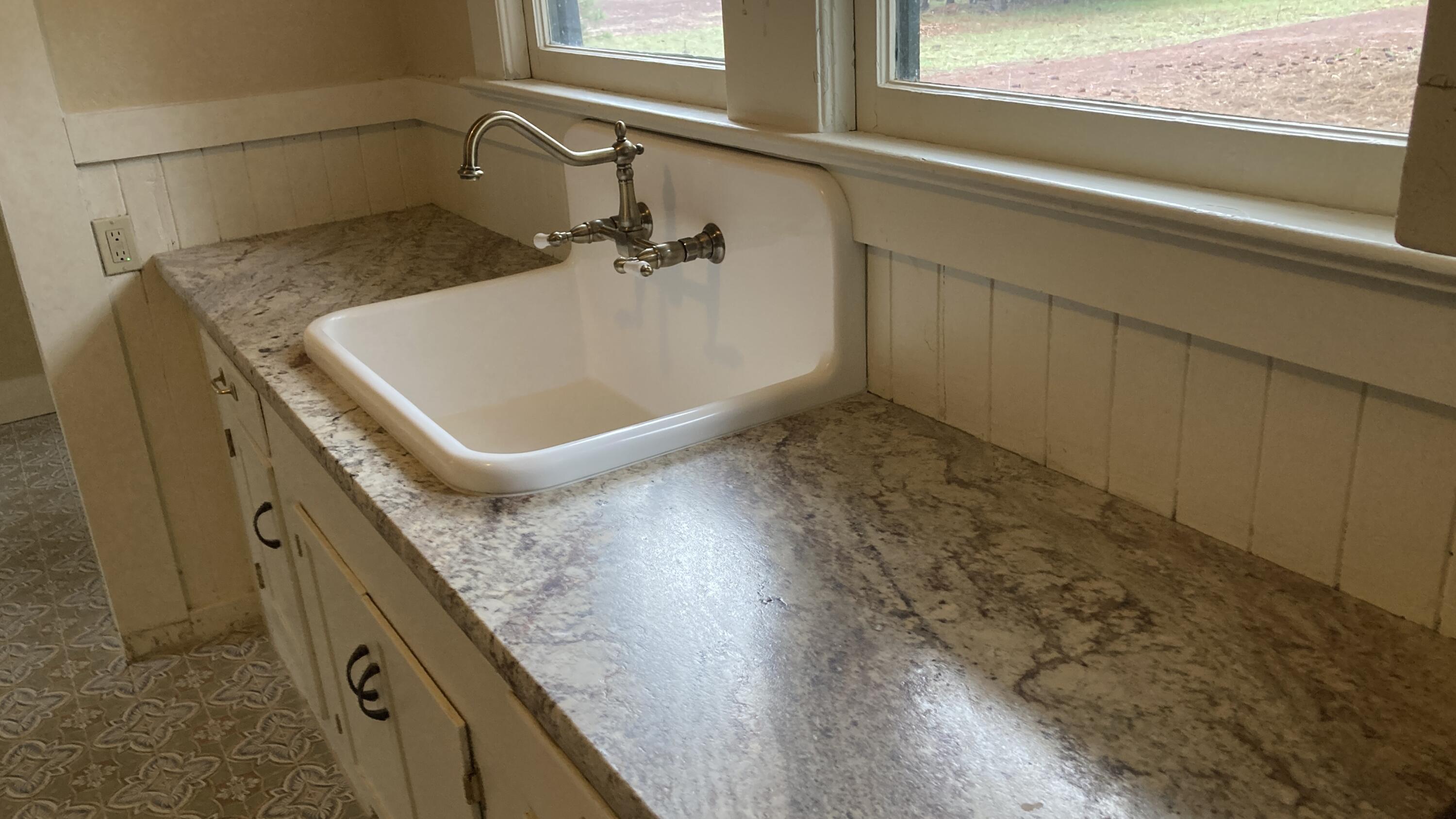 41008 Old School Road Fall River Mills, CA 96028 - Photo 34 of 53 a bathroom with a granite countertop sink and a mirror