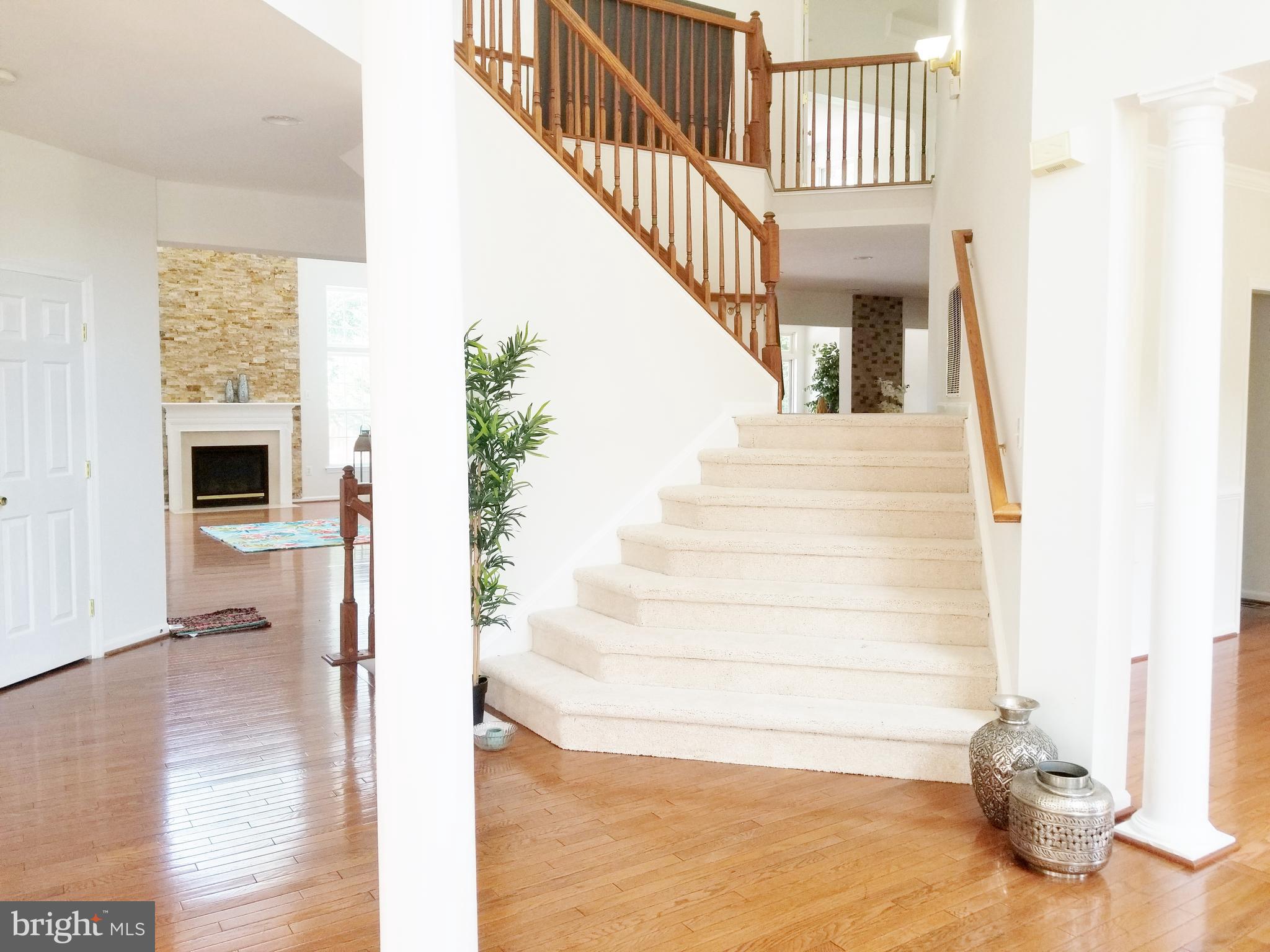 1818 Weybridge Road Frederick, MD 21702 - Photo 12 of 47 Stairs do not directly face Main door. Side stairs