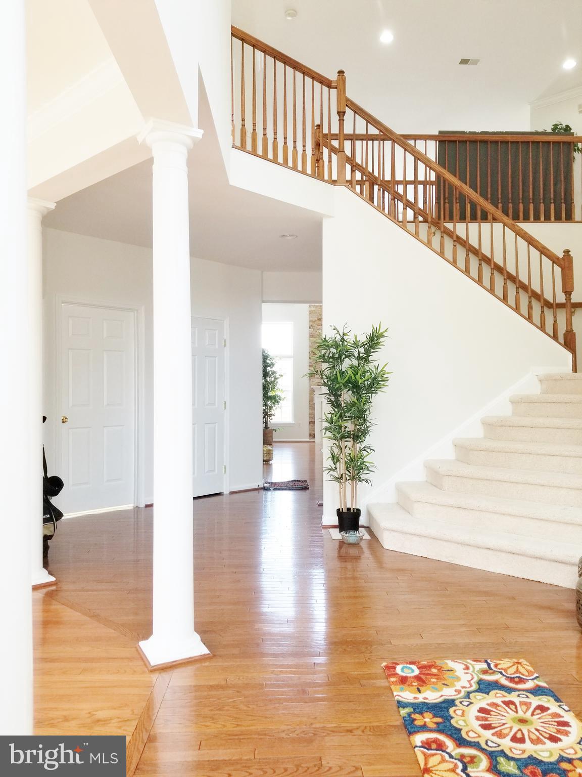 1818 Weybridge Road Frederick, MD 21702 - Photo 13 of 47 Foyer ceiling continues to Family room over bridge