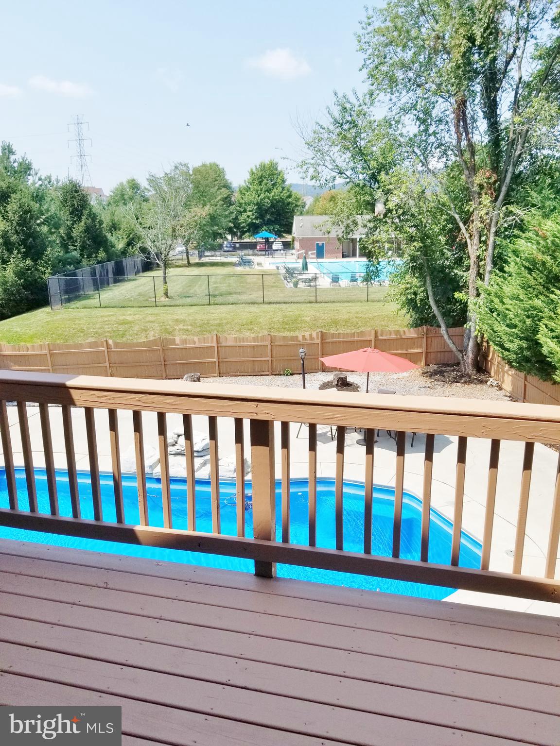 1818 Weybridge Road Frederick, MD 21702 - Photo 26 of 47 Master bedroom Balcony/Deck overlooks rear pool