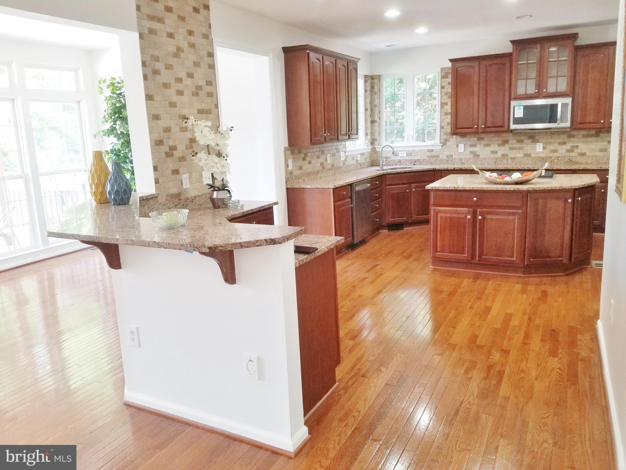 1818 Weybridge Road Frederick, MD 21702 - Photo 34 of 47 Kitchen with Bar and Morning room