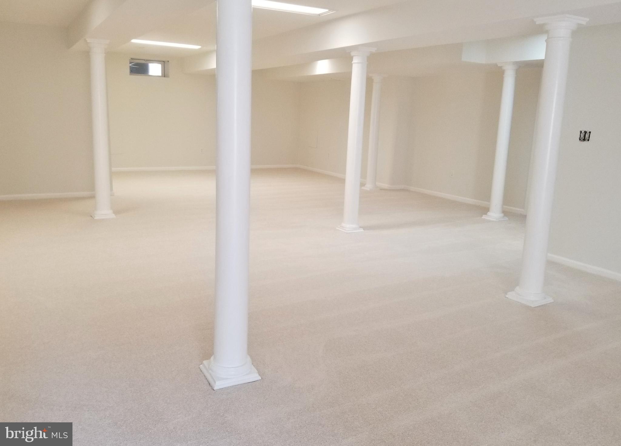 1818 Weybridge Road Frederick, MD 21702 - Photo 39 of 47 Recreation area. Set to have wet bar (Removed)