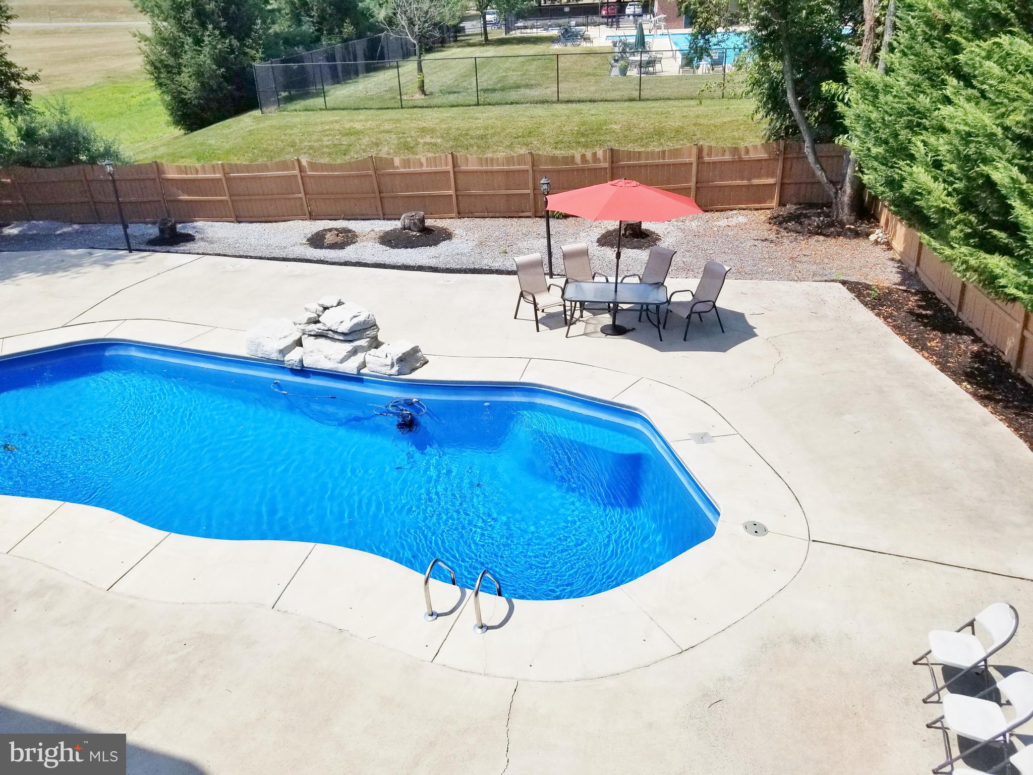 1818 Weybridge Road Frederick, MD 21702 - Photo 42 of 47 Huge In-ground heated pool with massive poolside