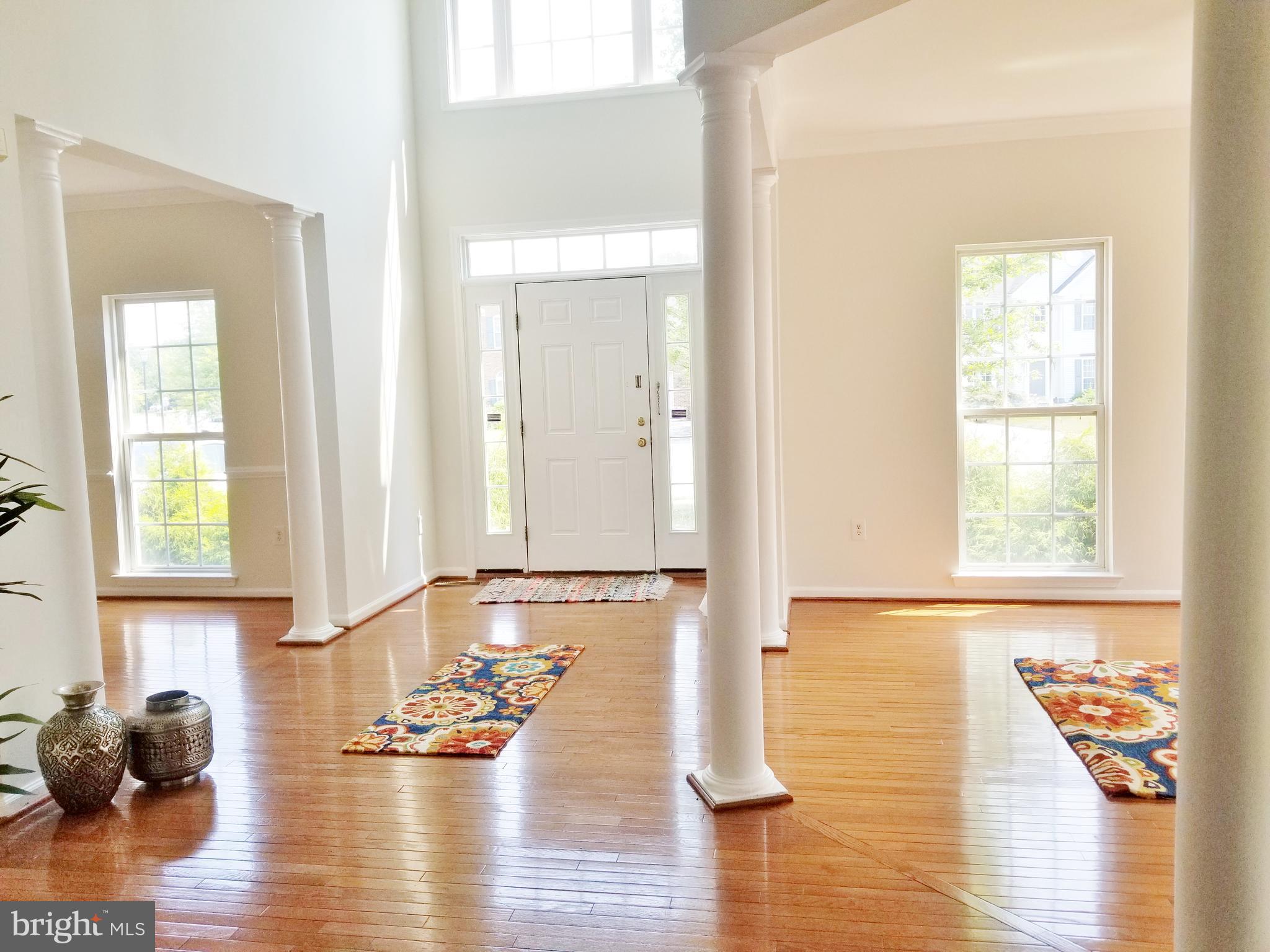 1818 Weybridge Road Frederick, MD 21702 - Photo 6 of 47 Formal dining room from 2-story foyer and pillars