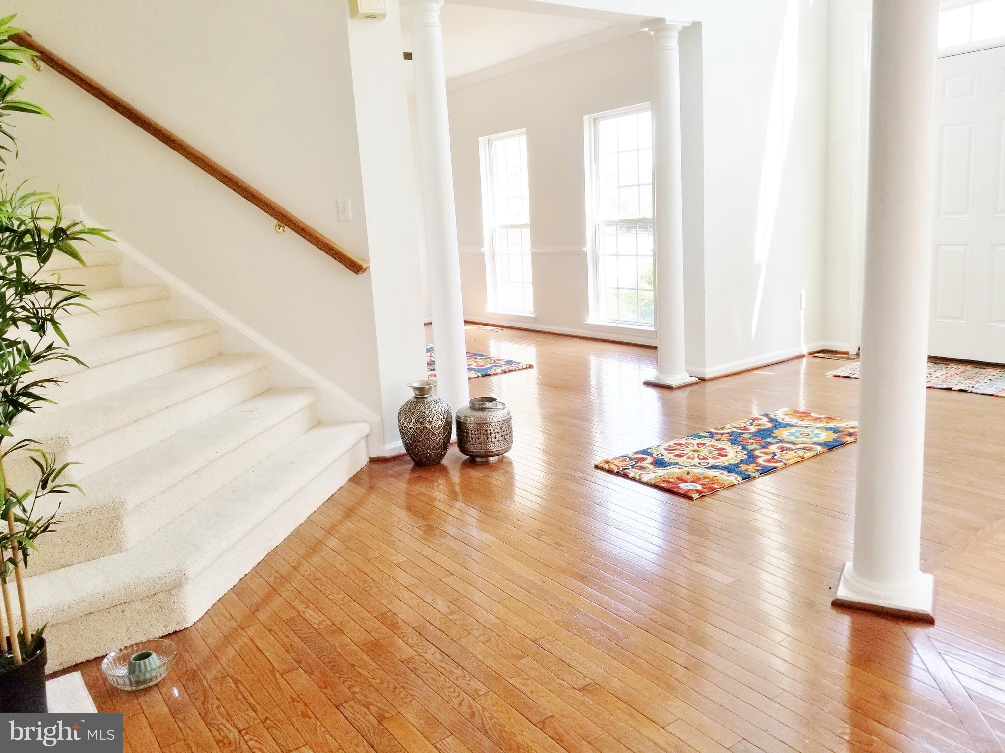 1818 Weybridge Road Frederick, MD 21702 - Photo 10 of 47 Angular staircase is on side of foyer