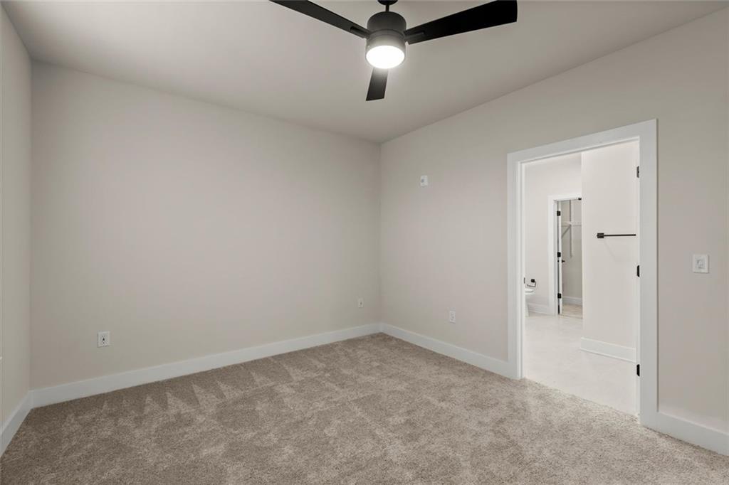 2648 Sandy Plains Road, Unit 422 Marietta, GA 30066 - Photo 19 of 37 an empty room with fan and windows