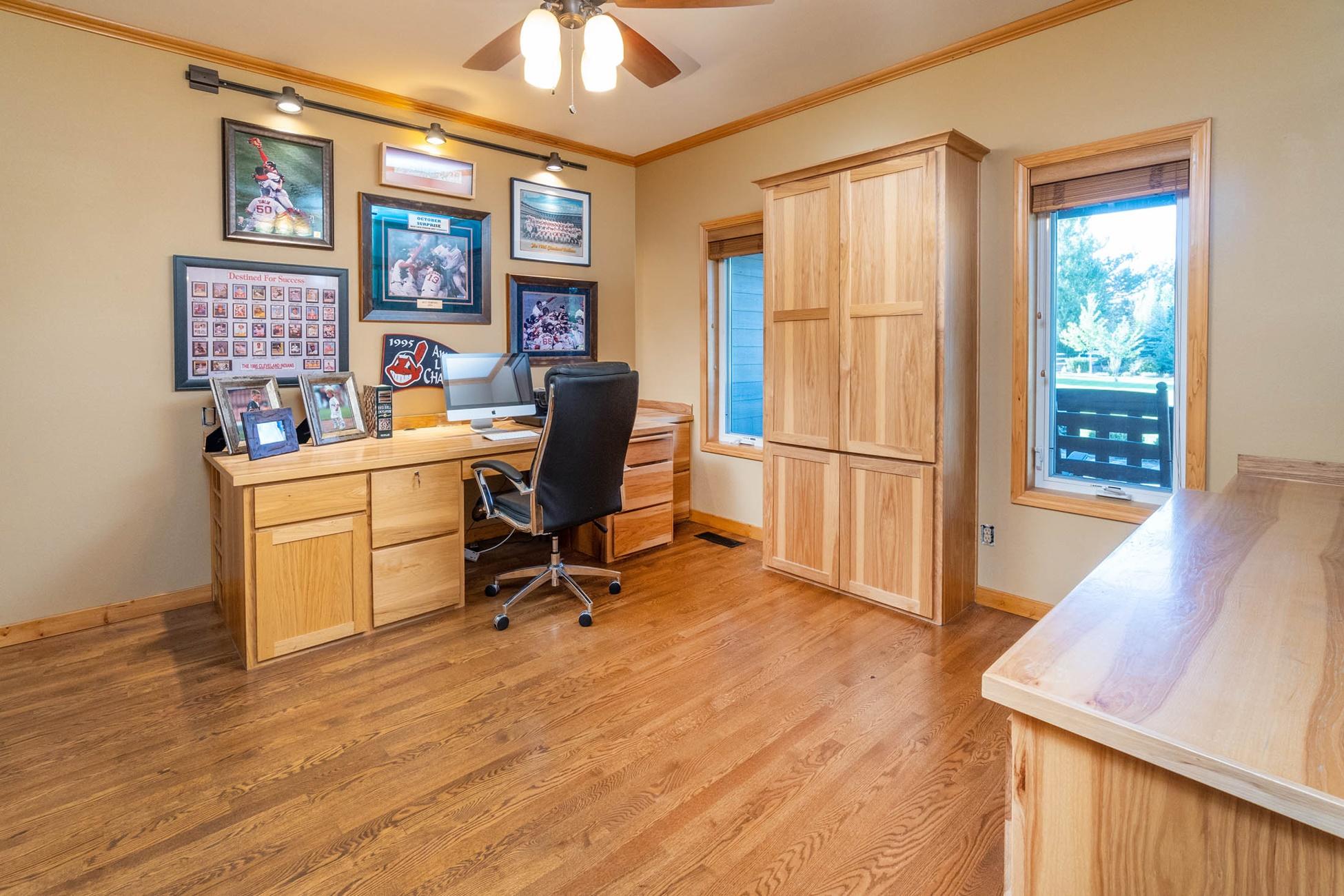 61899 Dobbin Court Bend, OR 97702 - Photo 10 of 26 a view of a workspace with furniture and a window