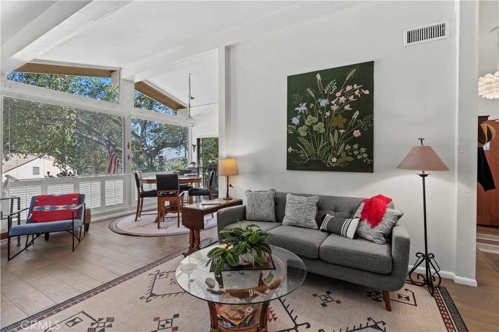 a living room with furniture and a rug