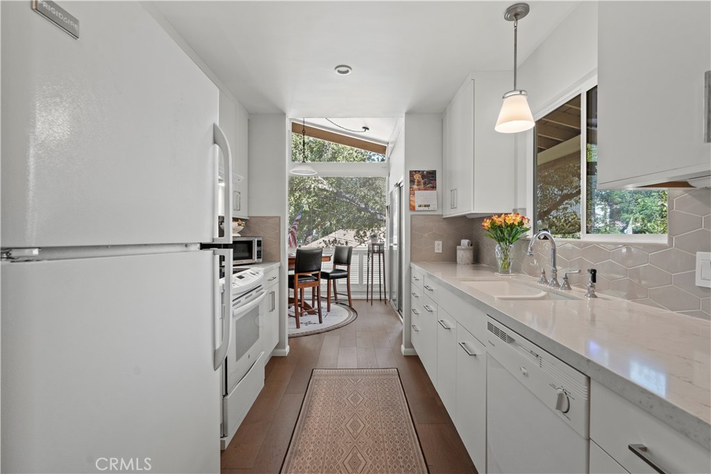 4214 Tosca Road Woodland Hills, CA 91364 - Photo 11 of 24 a large kitchen with sink and cabinets