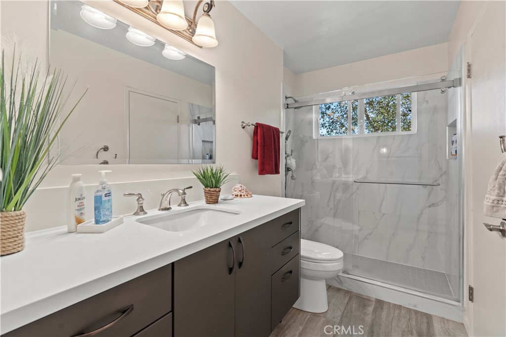 4214 Tosca Road Woodland Hills, CA 91364 - Photo 14 of 24 a bathroom with a sink a toilet and shower