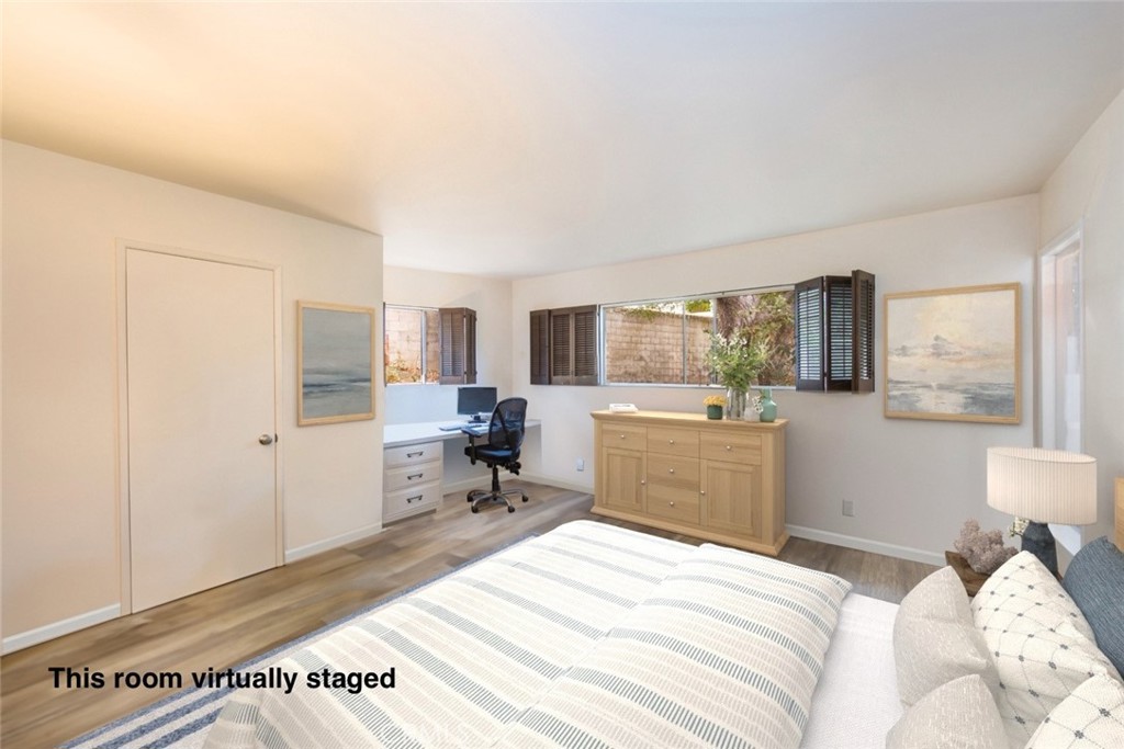 4214 Tosca Road Woodland Hills, CA 91364 - Photo 16 of 24 a bedroom with a bed and wooden floor