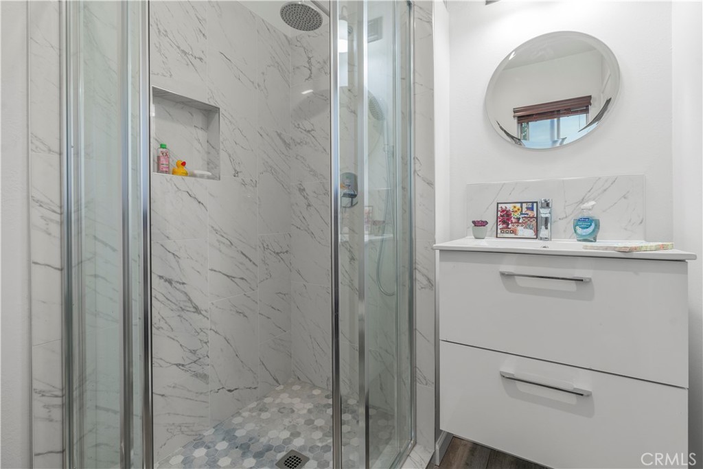 4214 Tosca Road Woodland Hills, CA 91364 - Photo 18 of 24 a bathroom with a shower and a sink