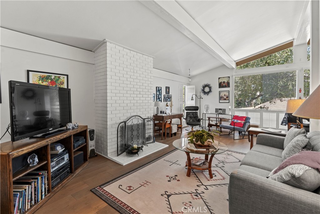 4214 Tosca Road Woodland Hills, CA 91364 - Photo 4 of 24 a living room with furniture and a flat screen tv