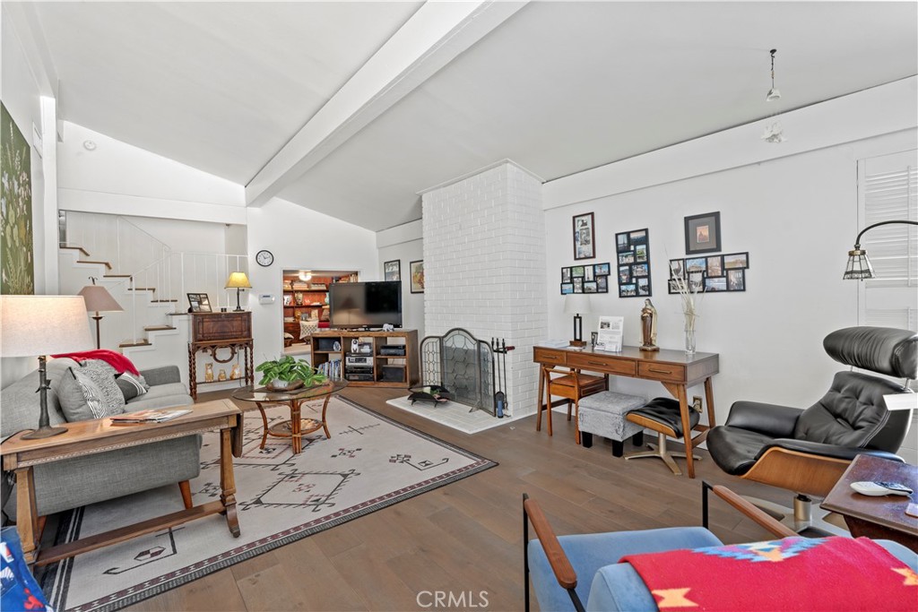 4214 Tosca Road Woodland Hills, CA 91364 - Photo 5 of 24 a living room with furniture a rug and a table